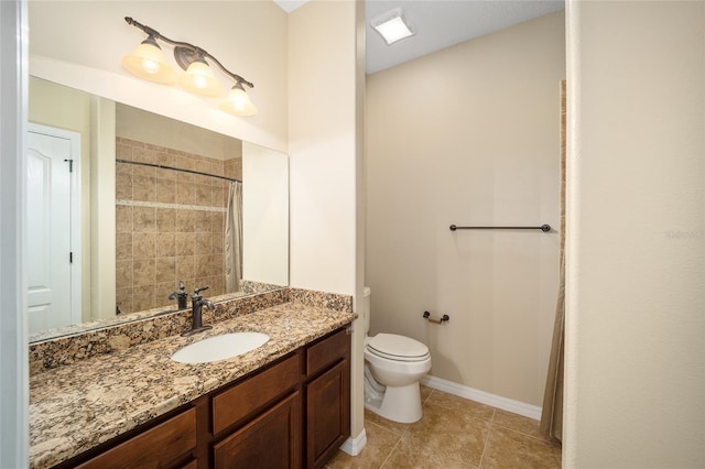 bathroom with vanity, toilet, and tile patterned floors