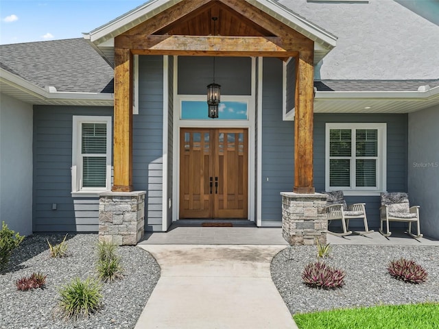 doorway to property featuring covered porch