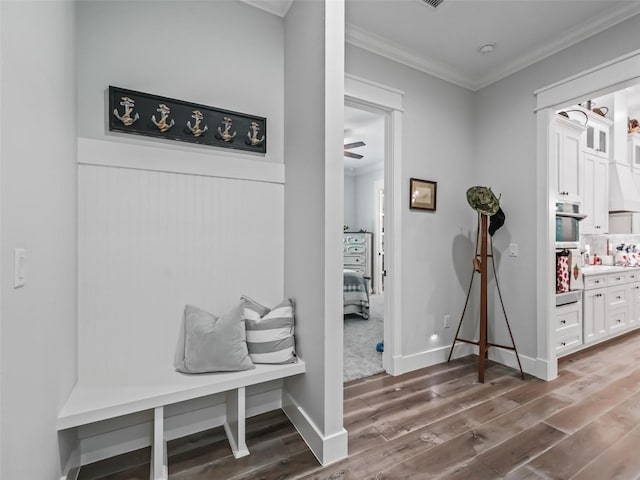 mudroom with ornamental molding, ceiling fan, and hardwood / wood-style floors