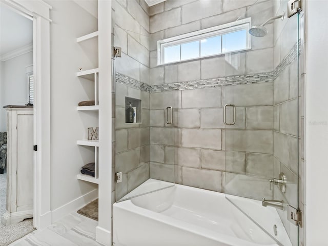 bathroom with tile patterned flooring, a bathing tub, and crown molding