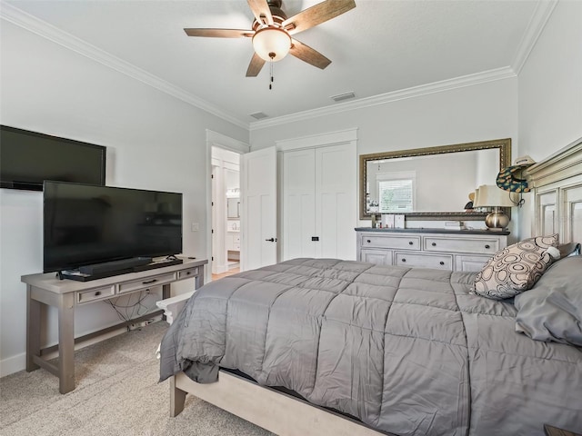 carpeted bedroom with crown molding, a closet, and ceiling fan