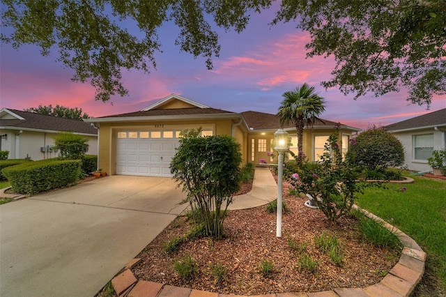 single story home with a garage