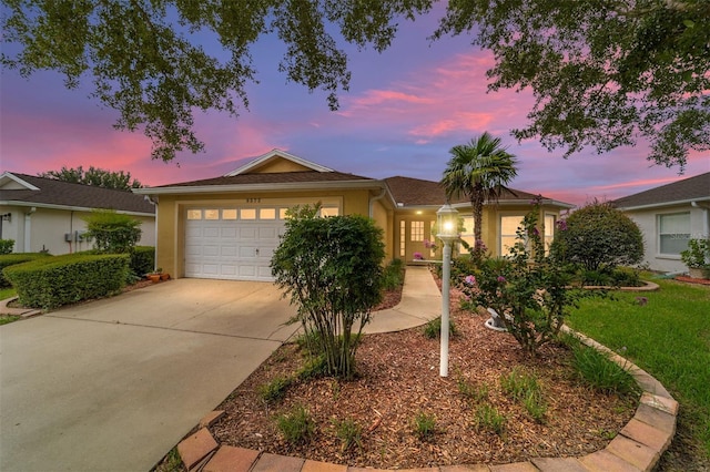 ranch-style home featuring a garage