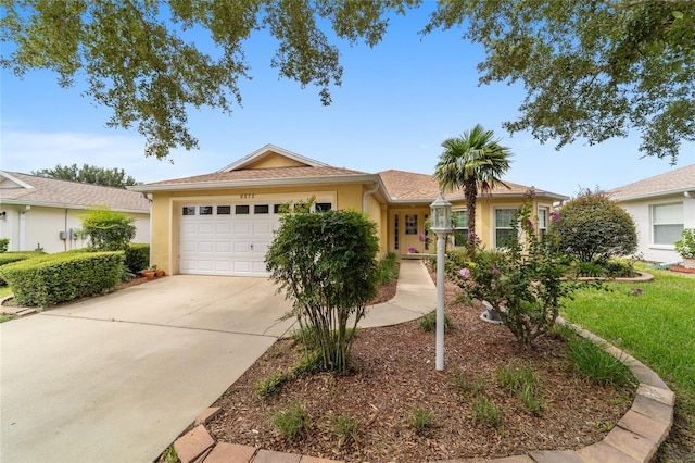 ranch-style home featuring a garage