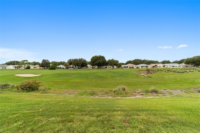 view of property's community featuring a yard