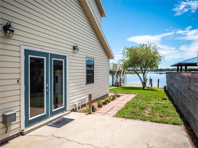 view of patio with a water view and a gazebo