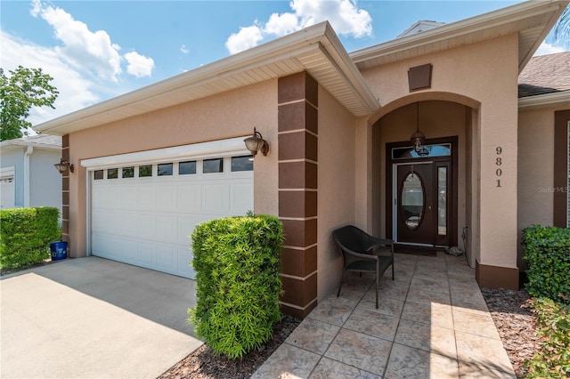 view of exterior entry with a garage