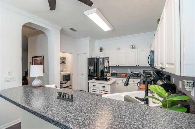 kitchen with ceiling fan, kitchen peninsula, white cabinetry, and ornamental molding