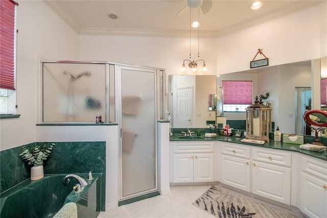 bathroom featuring a wealth of natural light, tile patterned floors, vanity, and a shower with shower door