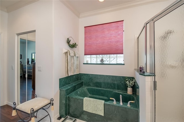 bathroom with crown molding, separate shower and tub, and wood-type flooring