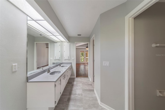 bathroom with vanity and ceiling fan