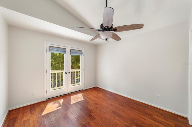 spare room featuring hardwood / wood-style floors, ceiling fan, and french doors