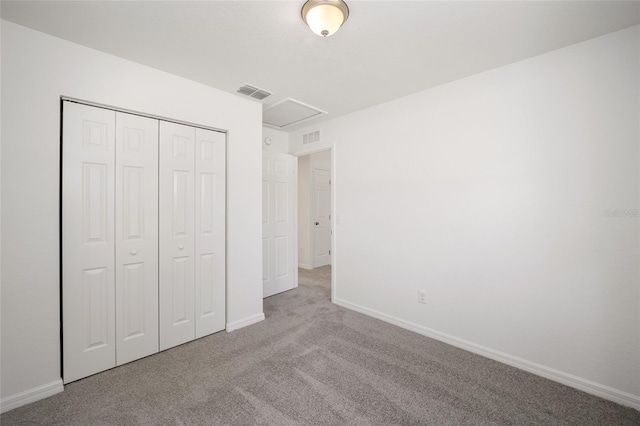 unfurnished bedroom featuring a closet and carpet floors