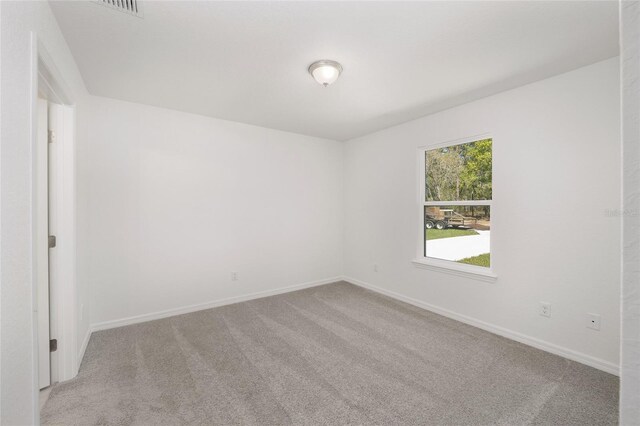 empty room featuring carpet floors