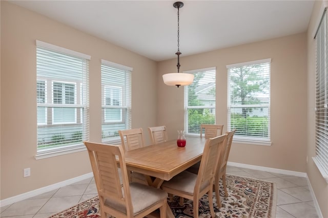 dining room featuring light tile patterned flooring and a wealth of natural light