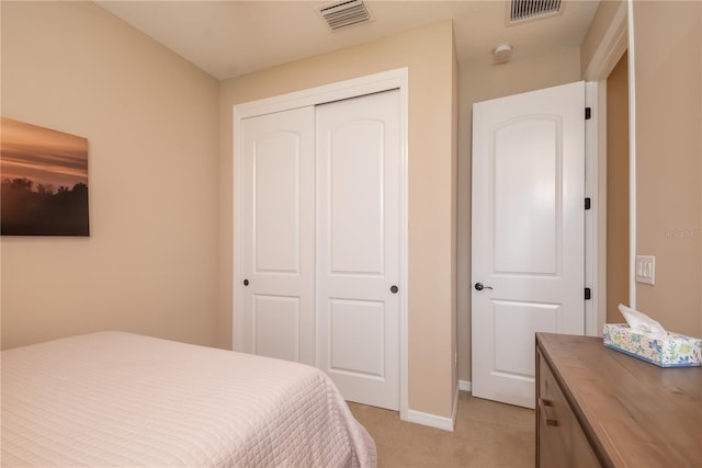 carpeted bedroom featuring a closet