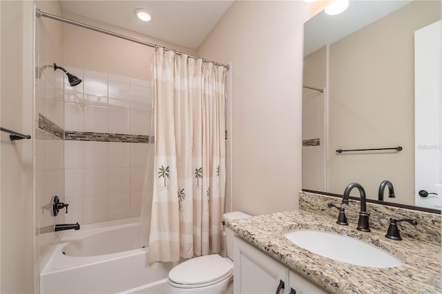 full bathroom with vanity, toilet, and shower / tub combo