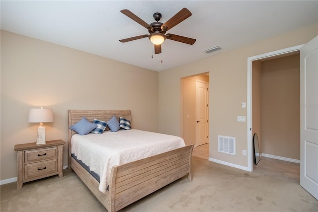 bedroom with light colored carpet and ceiling fan