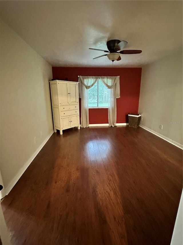 interior space featuring dark hardwood / wood-style flooring and ceiling fan