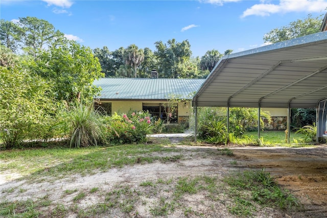 exterior space with a carport