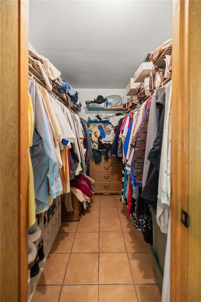 walk in closet featuring light tile patterned floors