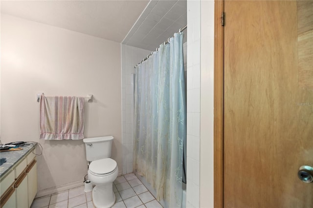 bathroom featuring vanity, toilet, and tile patterned flooring