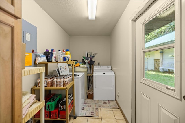 washroom with light tile patterned flooring and separate washer and dryer