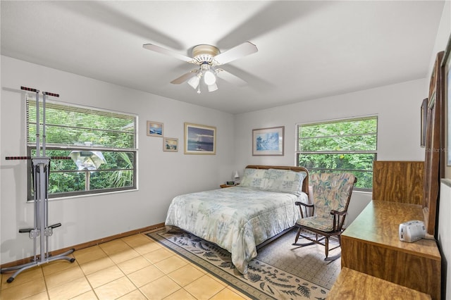 bedroom with light tile patterned flooring and ceiling fan