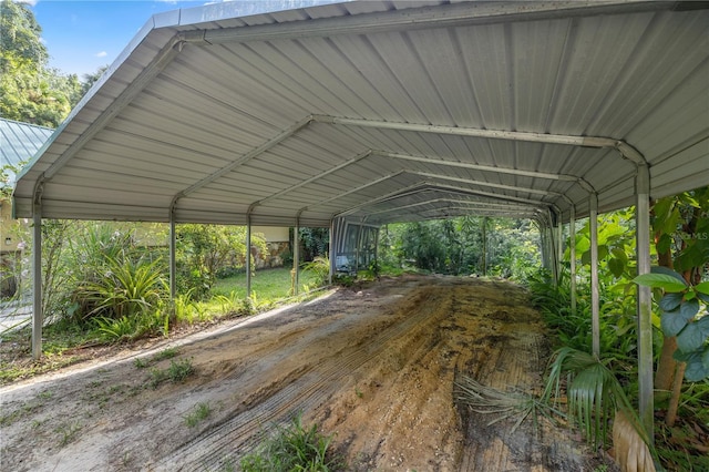 view of parking / parking lot featuring a carport