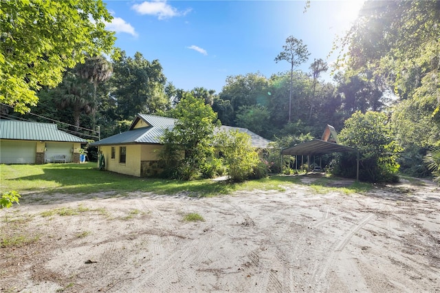 view of yard featuring a carport