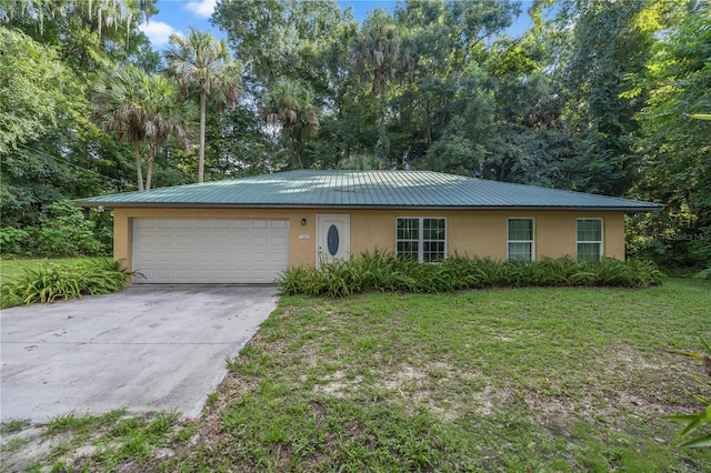 ranch-style home with a garage and a front lawn