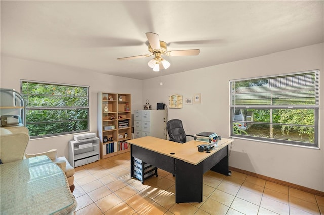 home office with light tile patterned flooring and ceiling fan