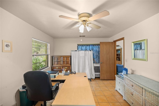 office area with light tile patterned flooring and ceiling fan