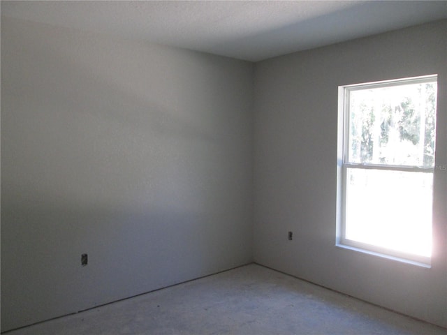 unfurnished room featuring a wealth of natural light