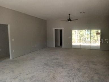 unfurnished living room featuring ceiling fan