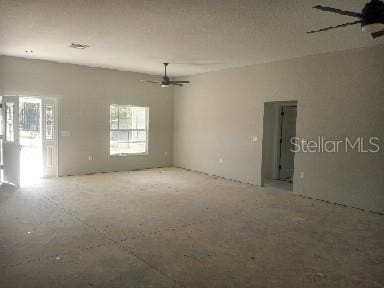 unfurnished room with ceiling fan