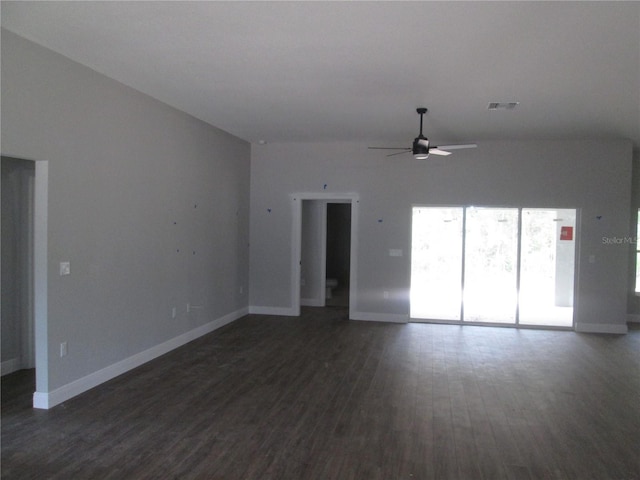 unfurnished living room with dark wood-type flooring and ceiling fan