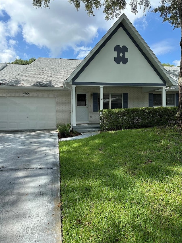 view of front of home featuring a garage and a front yard