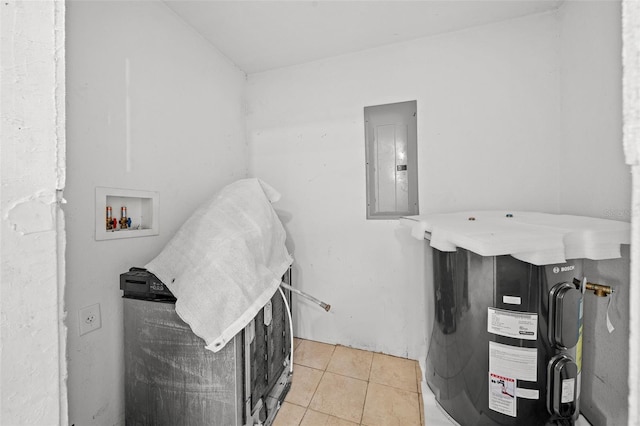 washroom with hookup for a washing machine, light tile patterned floors, and electric panel