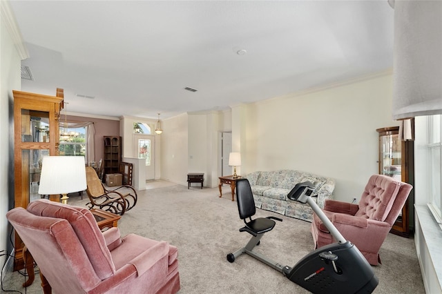 carpeted living room featuring crown molding