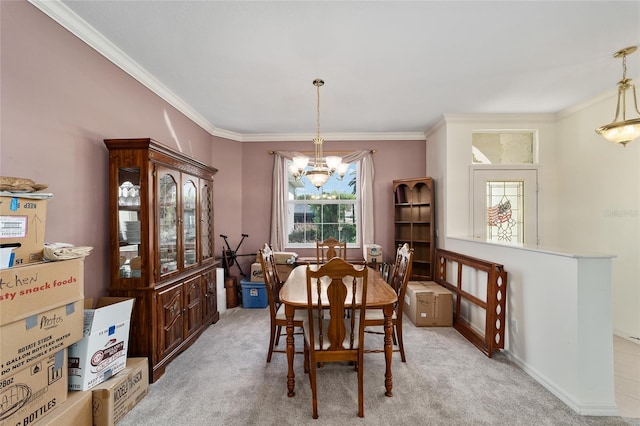 carpeted dining space with an inviting chandelier and ornamental molding