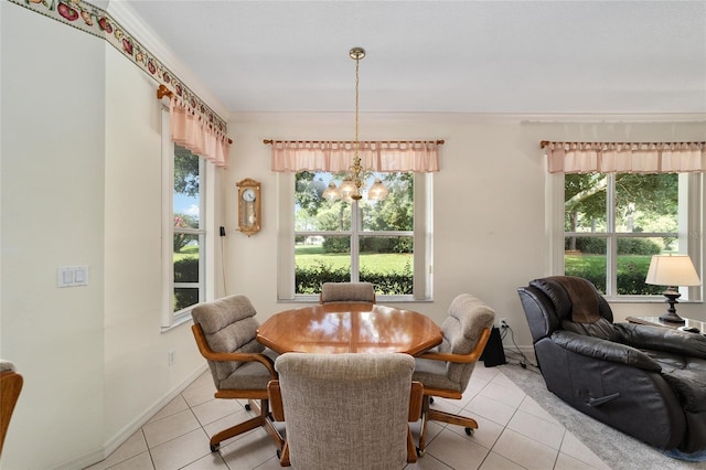 tiled dining area with a chandelier