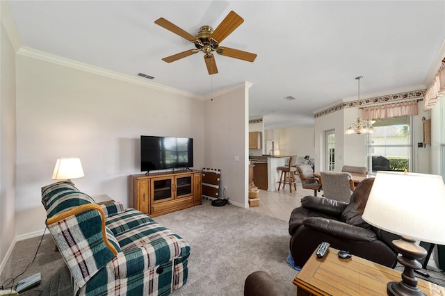 living room with light colored carpet, ceiling fan with notable chandelier, and ornamental molding