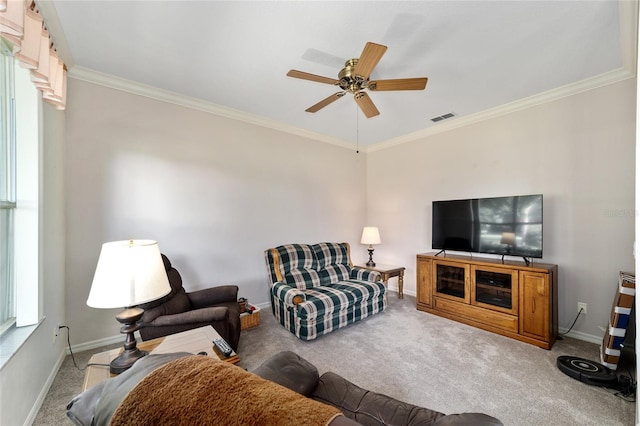 carpeted living room with ceiling fan and crown molding