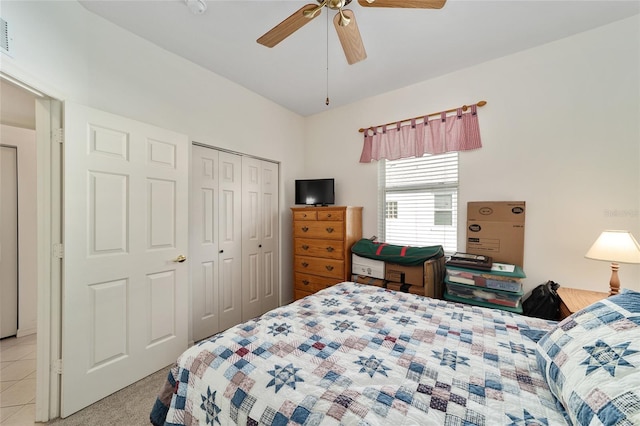 bedroom with ceiling fan and a closet