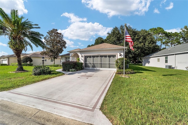 ranch-style home with central air condition unit and a front yard