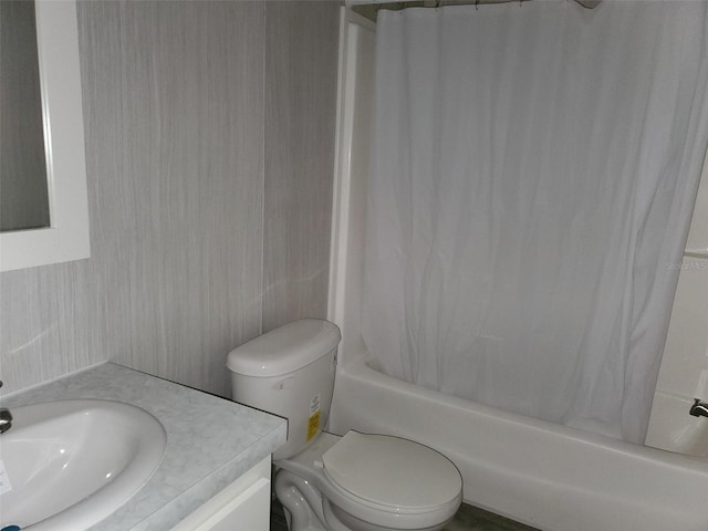 full bathroom with vanity, toilet, and shower / bath combination with curtain