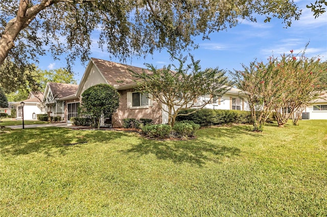 view of front of property featuring a garage and a front yard