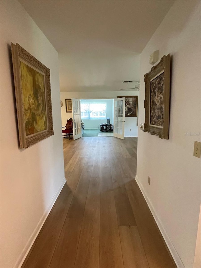 hallway featuring hardwood / wood-style flooring