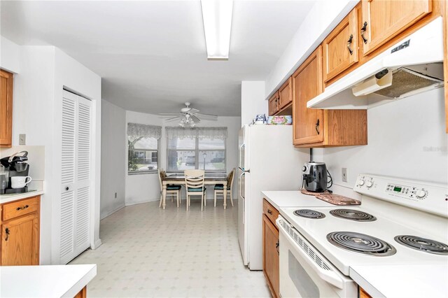 kitchen with white range with electric cooktop, ceiling fan, and light tile patterned floors